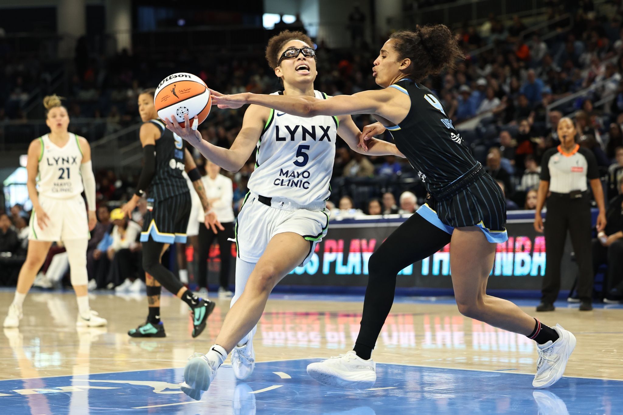Minnesota Lynx guard Olivia Miles drives to the basket against the Chicago Sky’s Skylar Diggins.