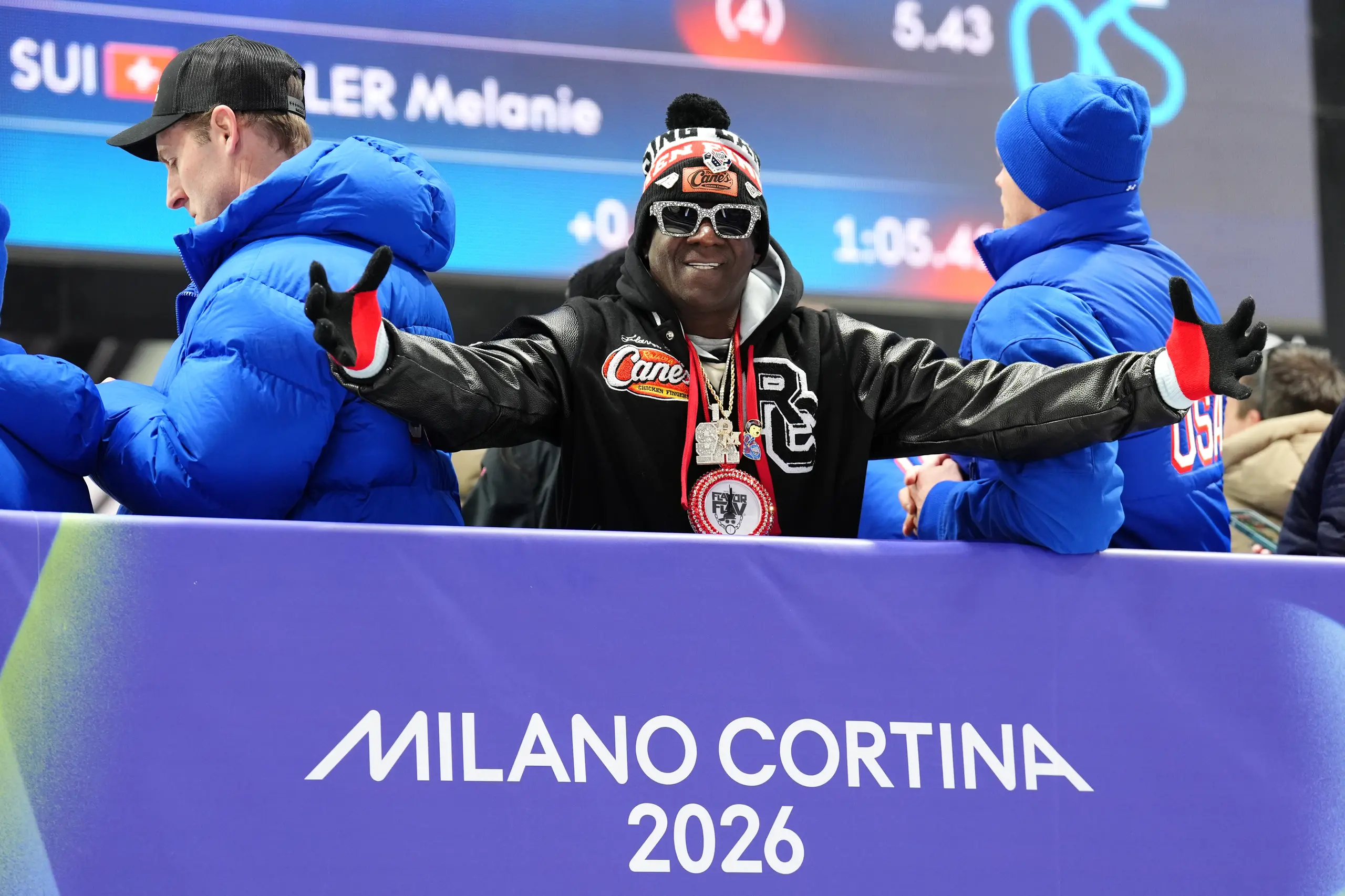 Flavor Flav watches on during the Women's Monobob Bobsleigh at the Cortina Sliding Centre, on day nine of the Milano Cortina 2026 Winter Olympics, Italy. 