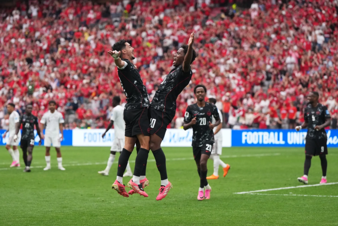 Jonathan David celebrates his goal against Qatar.