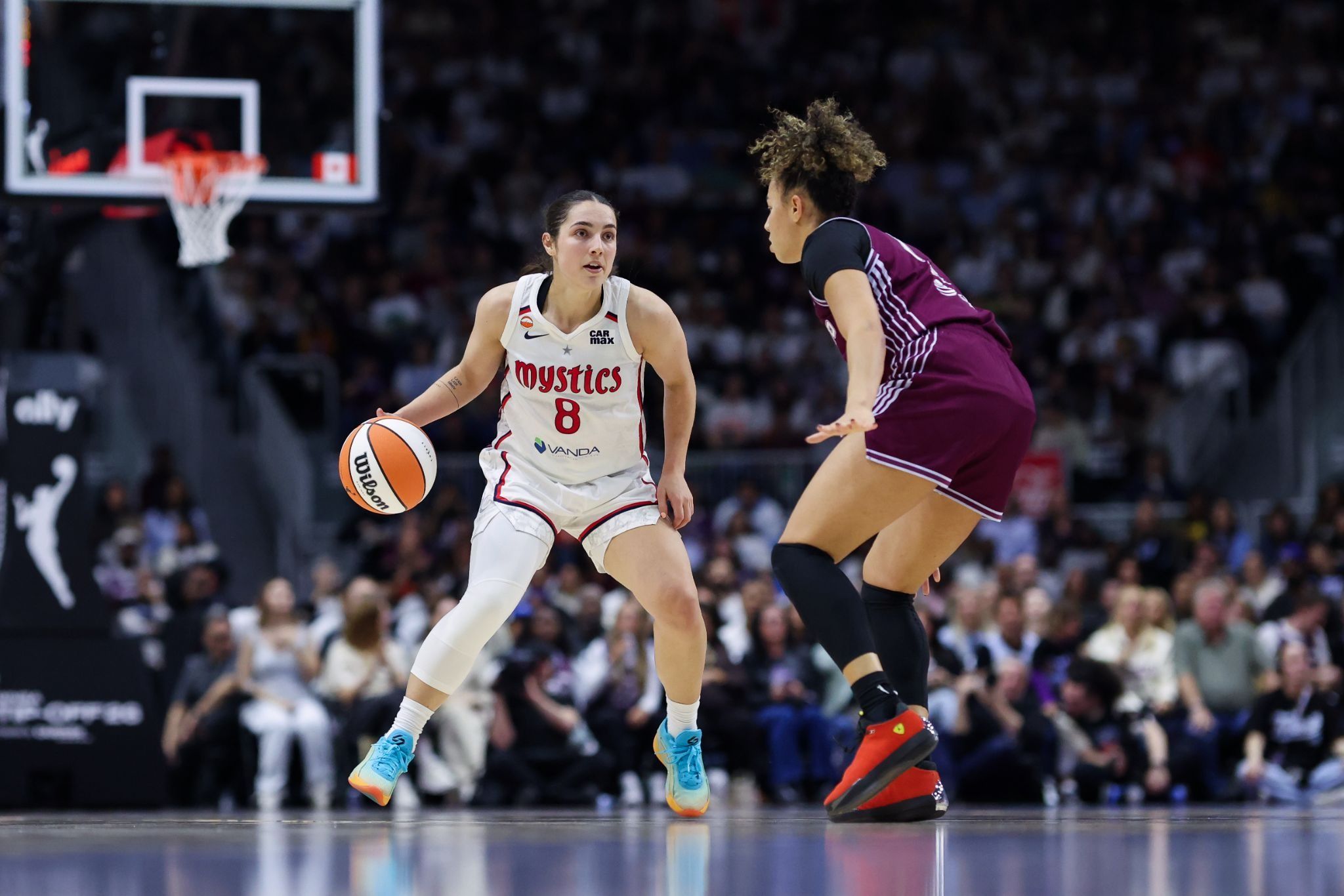 Washington Mystics guard Georgia Amoore dribbles the ball up the floor while being defended by the Toronto Tempo’s Kiki Rice.