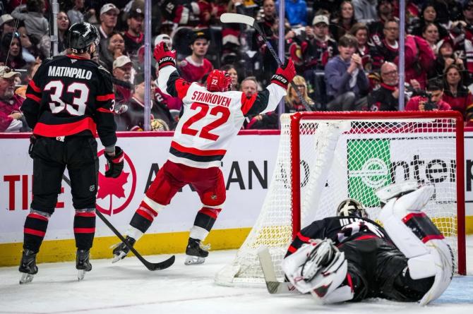 Carolina Hurricane Logan Stankoven celebrates after scoring a goal.