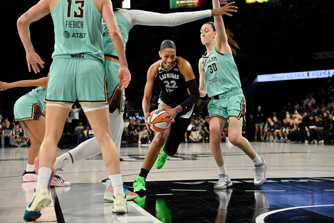 Las Vegas Ace A’ja Wilson is defended by the NY Liberty’s Breanna Stewart.
