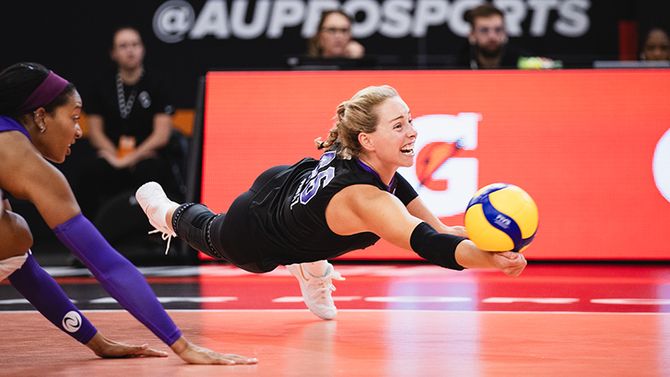 AU Pro Volleyball star Morgan Hentz dives to make a dig. 