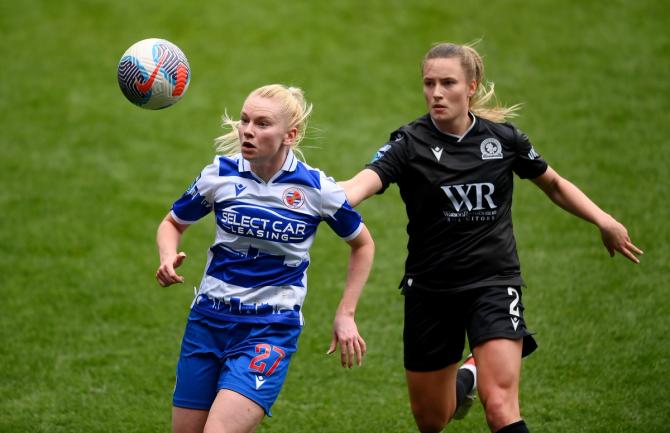 Jesse Woolley of Reading is challenged by Niamh Murphy of Blackburn Rovers during Barclays Women's Championship match between Reading and Blackburn Rovers at Select Car Leasing Stadium on March 31, 2024 in Reading, England.