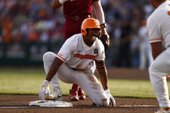 No. 1–seed Tennessee second baseman Christian Moore sticks out his tongue in victory while crouching on third base after blasting a triple during the Vols’ June 14th win over No. 8 Florida State.
