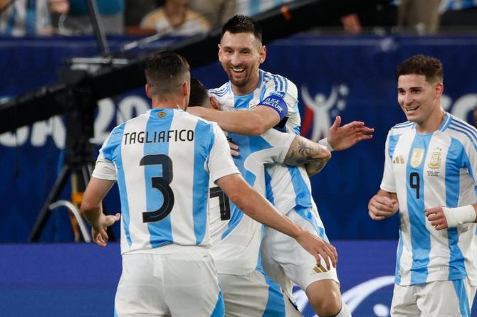 Lionel Messi celebrates with teammates after scoring