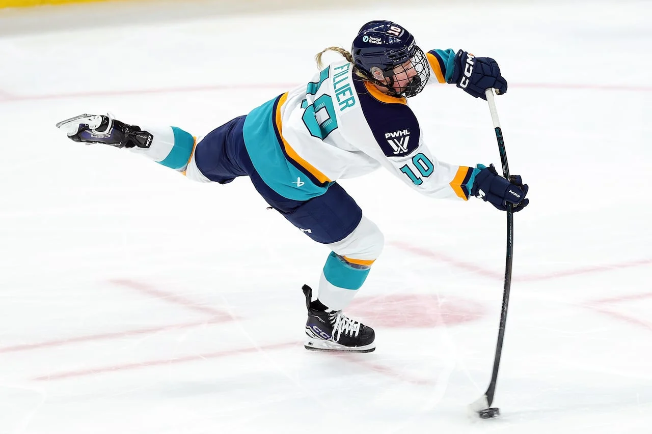 NY Sirens forward Sarah Fillier shoots the puck during a game.