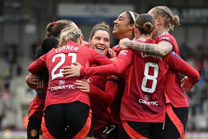 Dominique Janssen of Manchester United celebrates scoring her team's third goal during the Barclays Women's Super League match between Manchester United and Liverpool at Leigh Sports Village on December 08, 2024 in Leigh, England.