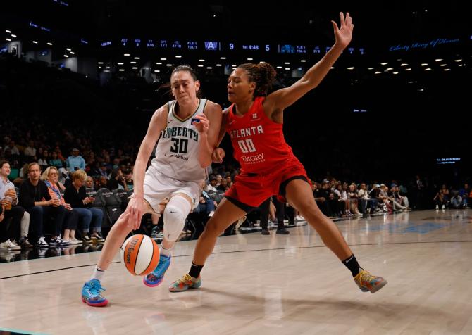 Naz Hillmon #00 of the Atlanta Dream guards Breanna Stewart #30 of the New York Liberty.