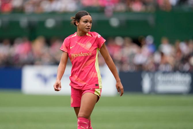 Sophia Smith of the Portland Thorns looks on as she stands on the pitch.