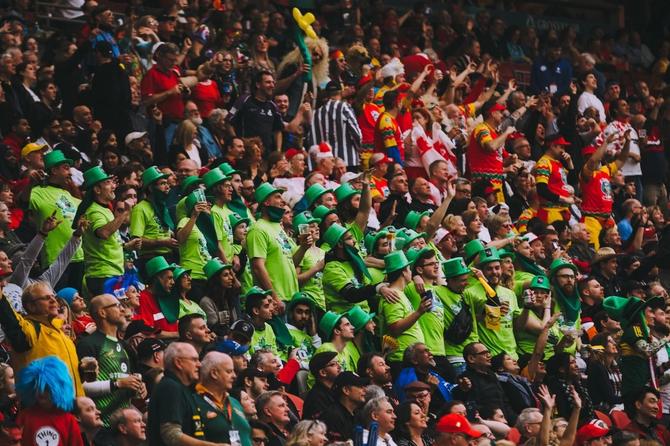 Crowd at a rugby game wearing green