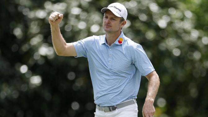 Justin Rose celebrates after the first round of the Masters.
