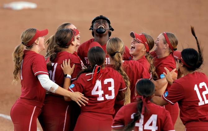 No. 8–seed Stanford softball teammates swarm pitcher NiJaree Canady after her clutch strikeout sent them to the NCAA Super Regionals on May 19th.