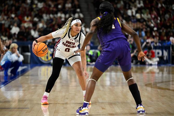 Te-Hina Paopao #0 of the South Carolina Gamecocks dribbles against LSU’s Flau'Jae Johnson