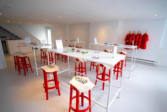 Event space with Team Canada jerseys and upcycling supplies