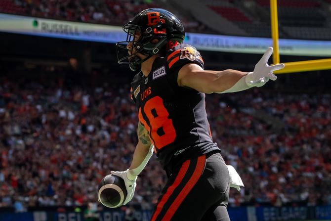 BC Lions wide receiver Justin McInnis celebrates a touchdown with his arms outstretched during a game against the Saskatchewan Roughriders this summer.
