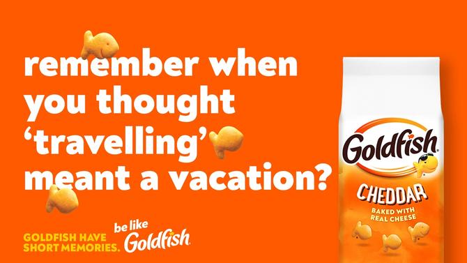 Goldfish ad with the text: 'Remember when you thought 'travelling' meant a vacation?' and a bag of Cheddar Goldfish crackers on an orange background.