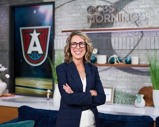 Atlanta Dream president Morgan Shaw Parker stands in front of an Atlanta Dream logo on the set of CBS Mornings.