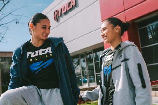 Alyssa Thompson and Gisele Thompson of Angel City FC are pictured wearing TOCA apparel.