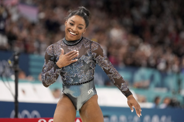 Simone Biles smiles at the 2024 Paris Olympics.