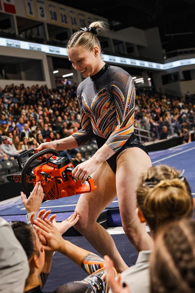 Oregon State gymnast Jade Carey celebrates with her teammates during a meet with Cal and UCLA.