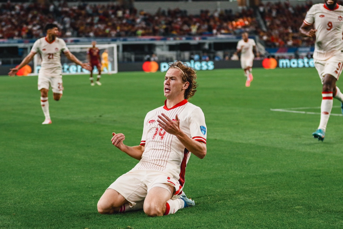 CanMNT players celebrate during their quarter-final victory