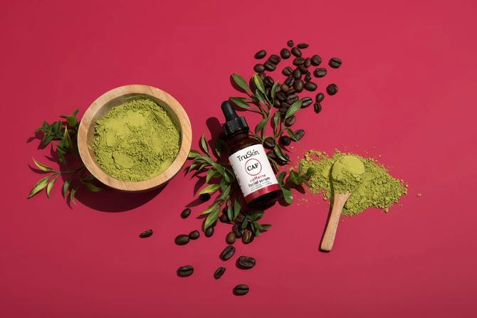 A graphic of TruSkin products on a red background