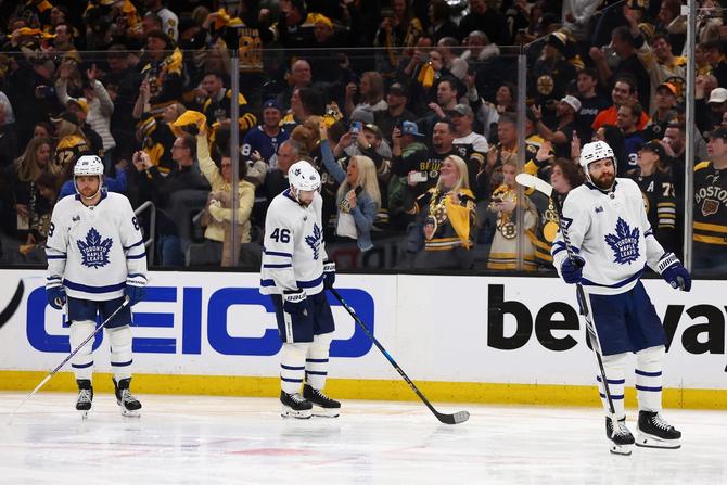 William Nylander #88, Ilya Lyubushkin #46 and Timothy Liljegren #37 of the Toronto Maple Leafs react after being defeated by the Boston Bruins in Game Seven of the First Round of the 2024 Stanley Cup Playoffs