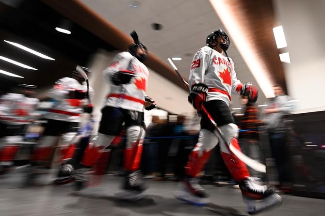 Marie-Philip Poulin of Canada leads her team to the ice.