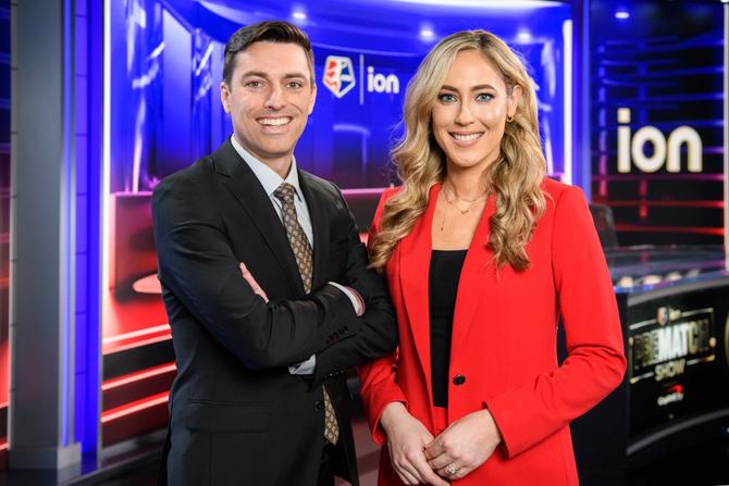 Broadcasters Seb Salazar and Kylen Mills stand in NWSL on ION studio.