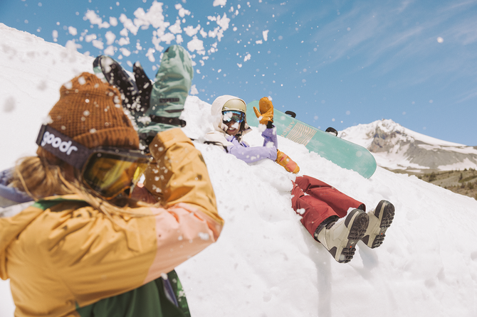 Snowboarders playing in the snow
