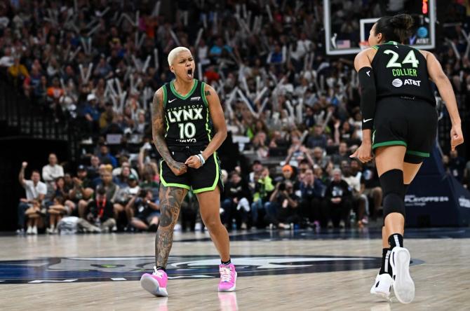 Minnesota Lynx players Courtney Williams and Napheesa Collier celebrate after making a shot during Game 2 against the Phoenix Mercury.