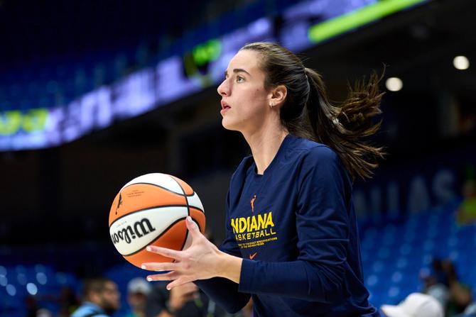 Caitlin Clark #22 of the Indiana Fever warms up before tipoff against the Dallas Wings at the College Park Center on July 17, 2024 in Arlington, Texas.