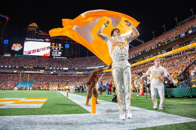 A Tennessee Volunteers cheerleader celebrates the touchdown during the college football game between the North Carolina State Wolfpack and the Tennessee Volunteers on September 7, 2024 at Bank of America Stadium in Charlotte, NC.