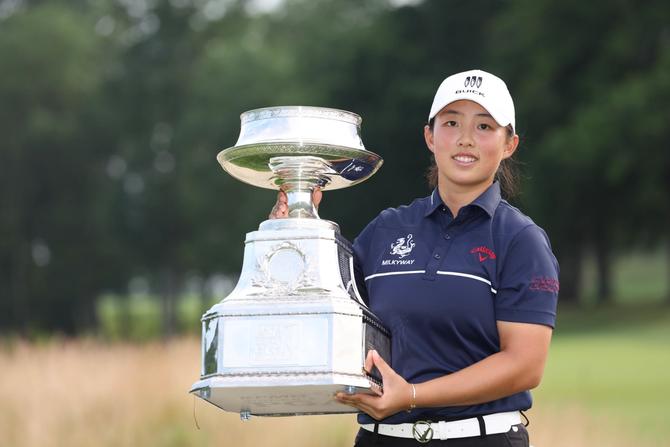 Ruoning Yin of China poses for a photo with the trophy after winning the KPMG Women's PGA Championship at Baltusrol Golf Club