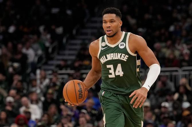 Giannis Antetokounmpo dribbling a basketball