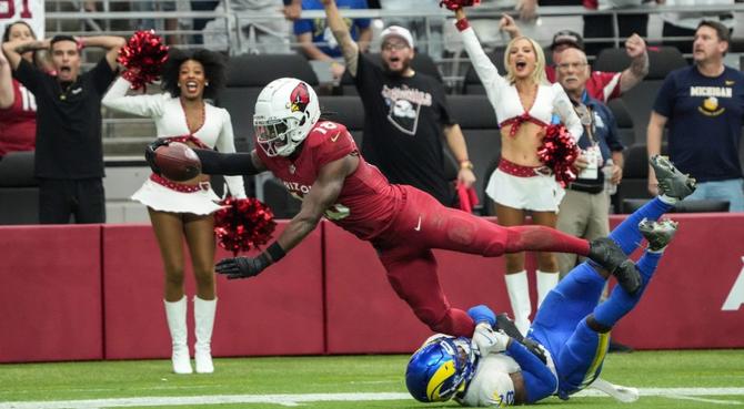 Arizona Cardinals wide receiver Marvin Harrison Jr. scores a touchdown.
