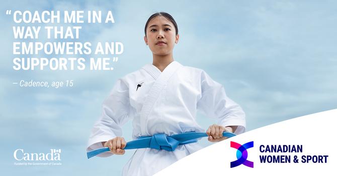 Cadence holding her blue belt while posing
