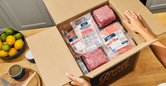 A person unpacking a package from Good Chop