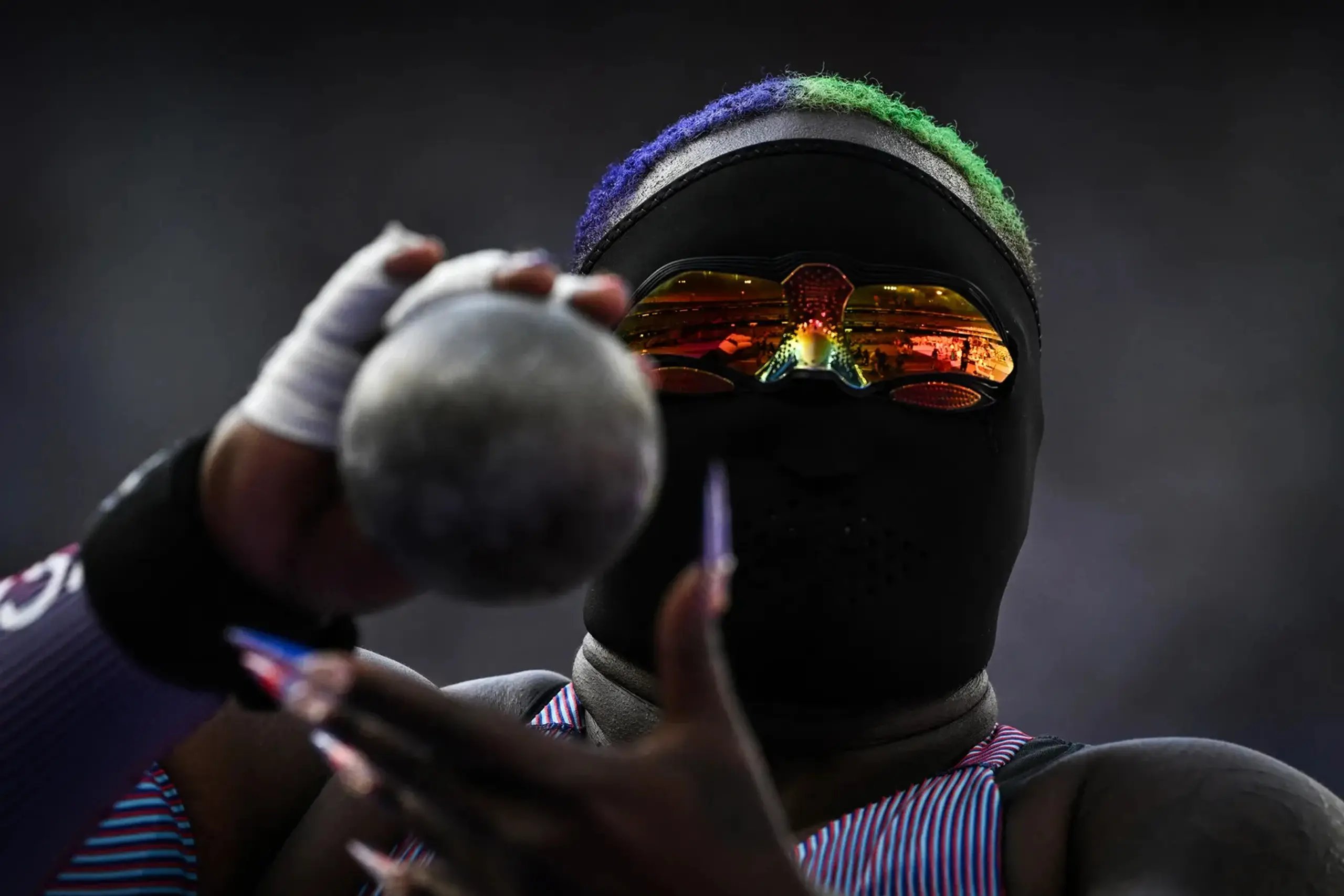 A masked Raven Saunders competes at the Paris 2024 Olympics