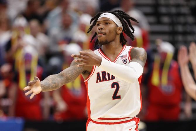 No. 2–seed Arizona guard Caleb Love reacts after sinking a three-pointer in Saturday’s win over No. 7 Dayton.