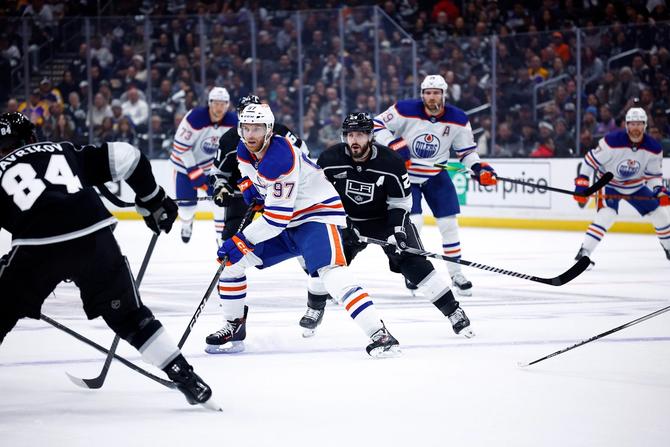 Connor McDavid #97 of the Edmonton Oilers skates the puck against the Los Angeles Kings in the first period during Game Four of the First Round of the 2024 Stanley Cup Playoffs