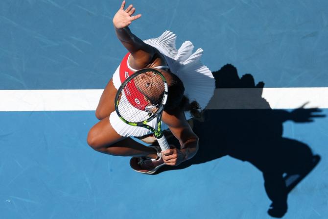 A view looking down on Leylah Fernandez serving.