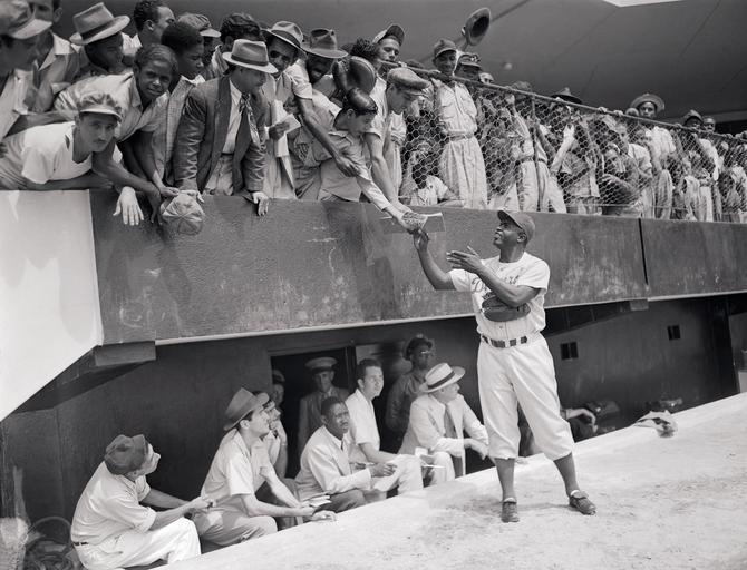 Jackie Robinson Signing Autographs from Field