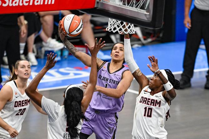Golden State forward Gabby Williams drives to the basket.