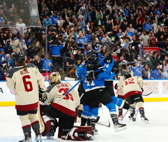 Toronto celebrates Jesse Compher's goal, which opened the scoring in the third period.