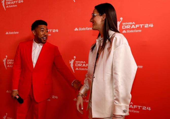 Kevin Miles, also known as Jake from State Farm, talks with Caitlin Clark prior to the 2024 WNBA Draft at Brooklyn Academy of Music on April 15, 2024 in New York City.