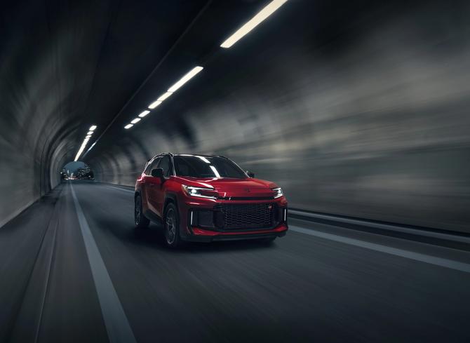 Red Toyota RAV4 drives through tunnel