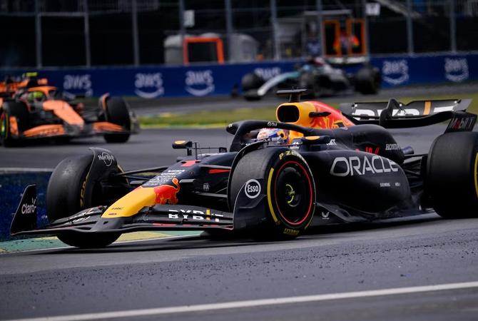 Red Bull’s Max Verstappen races around a corner while being chased by a McLaren at the Canadian Grand Prix.