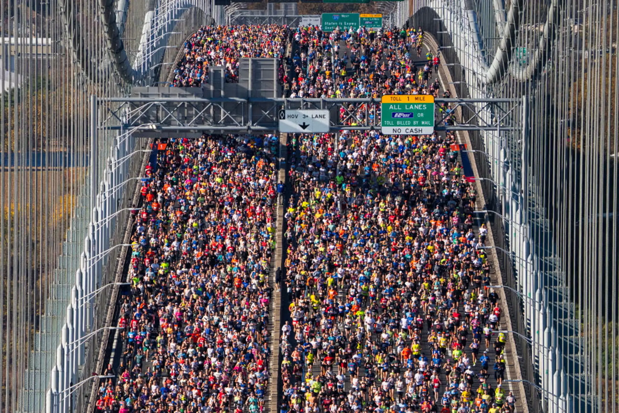 Runners cross a bridge during the New York City Marathon.